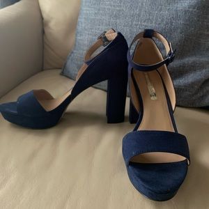 Navy blue platform shoe with ankle strap detail
